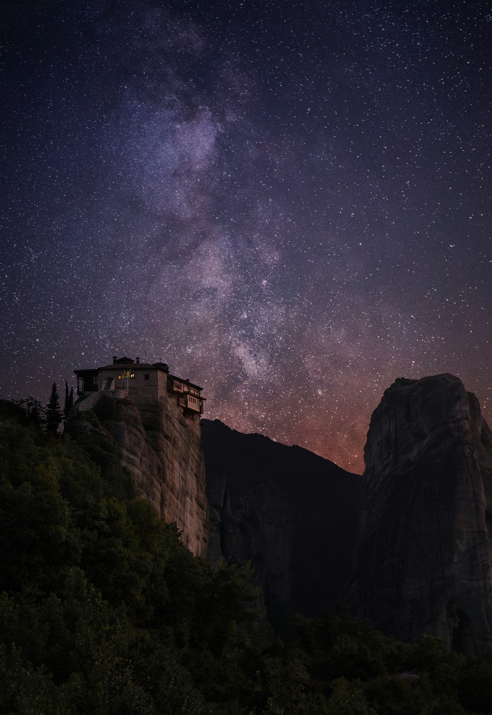 milky way above rocks