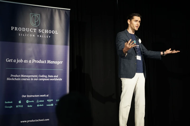 A speaker confidently addressing an audience on stage