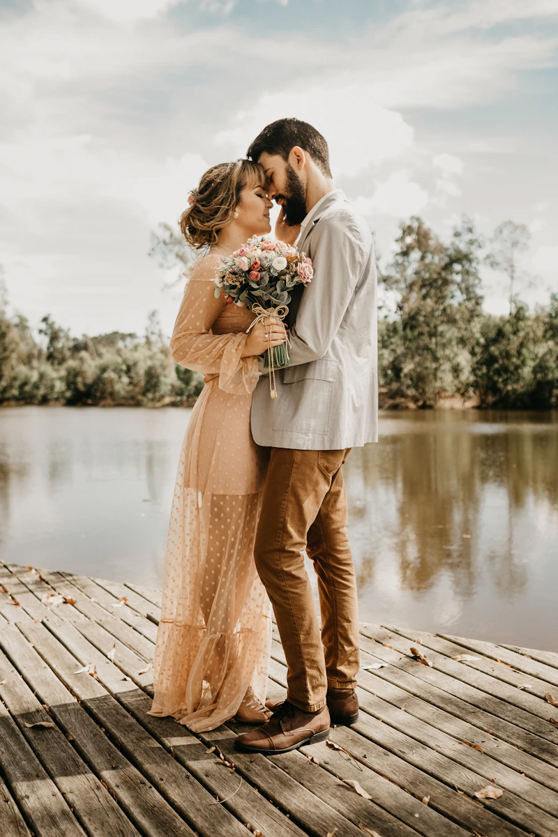 Couple standing together on a wooden dock
