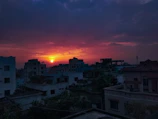 High-resolution still from a cinematic short film showing a dramatic sunset over a cityscape.