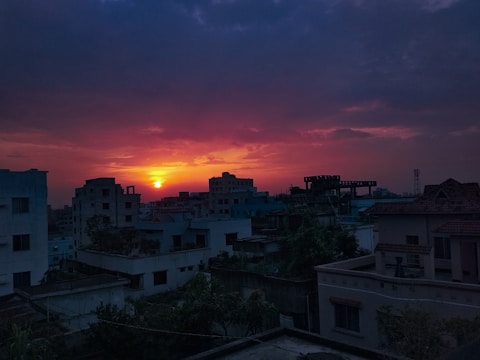 A still frame from a medium-length film showing a dramatic sunset over a city skyline.