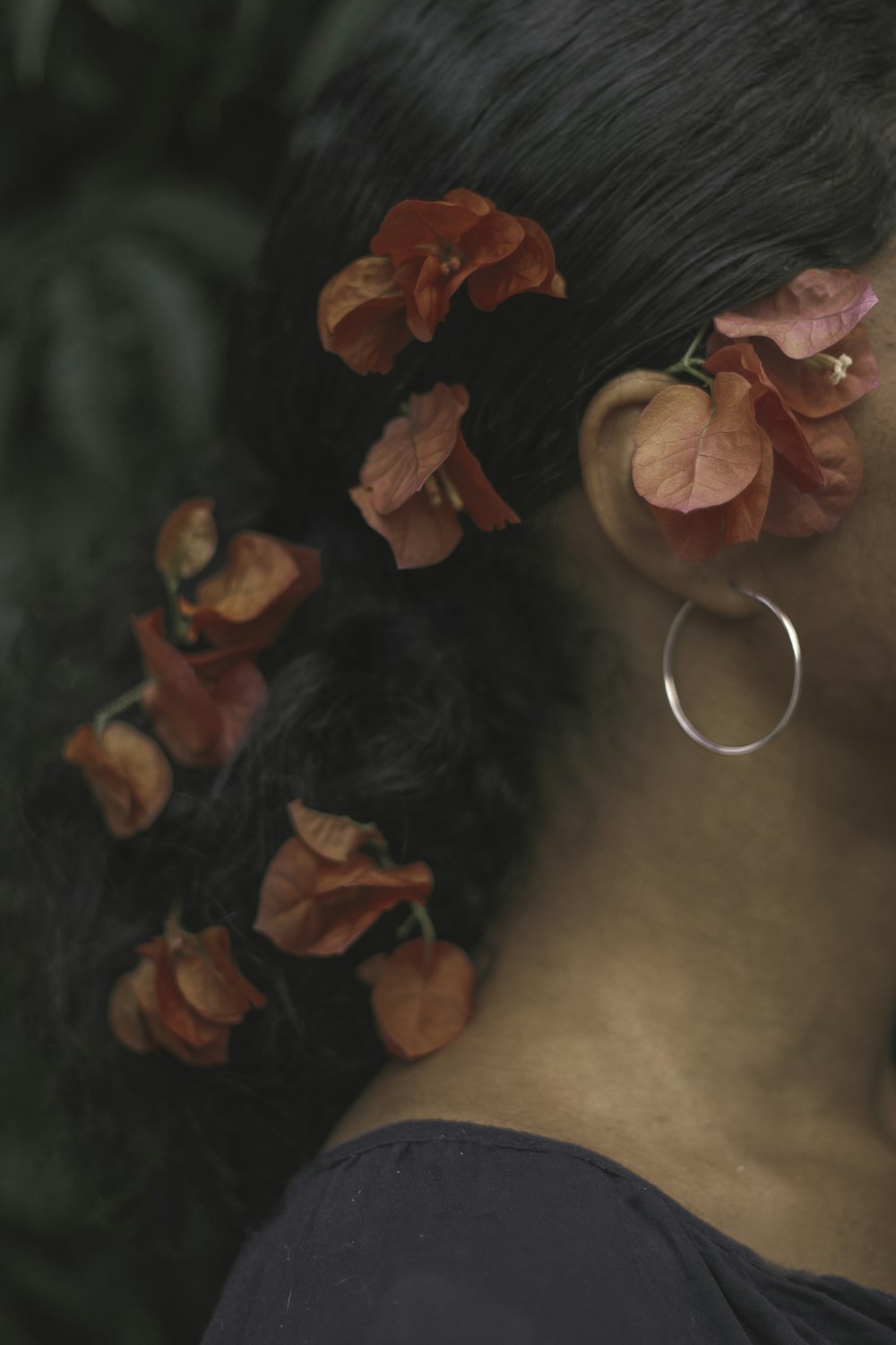 a woman with a flower in her hair