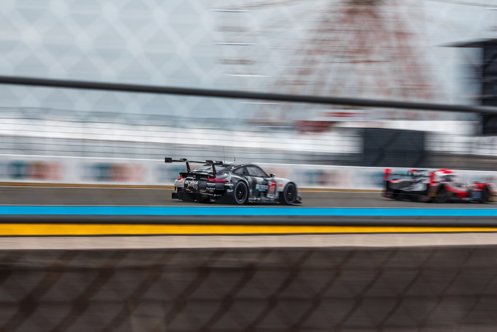 panning photography of racing cars