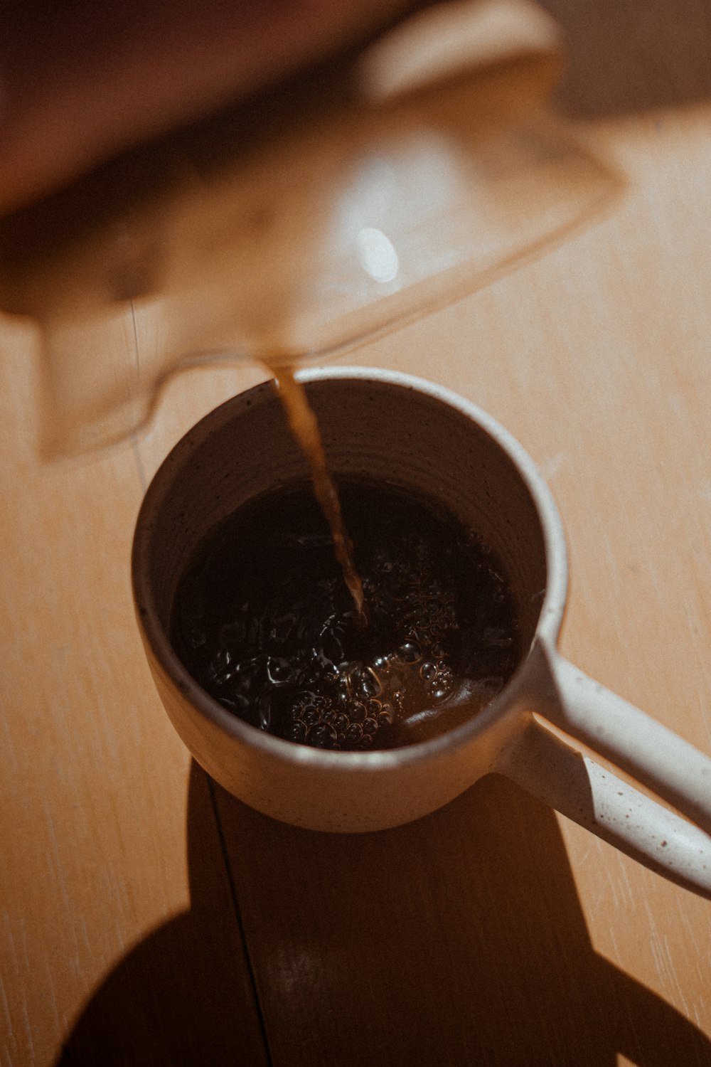 coffee in a white ceramic coffe cup close-up photography