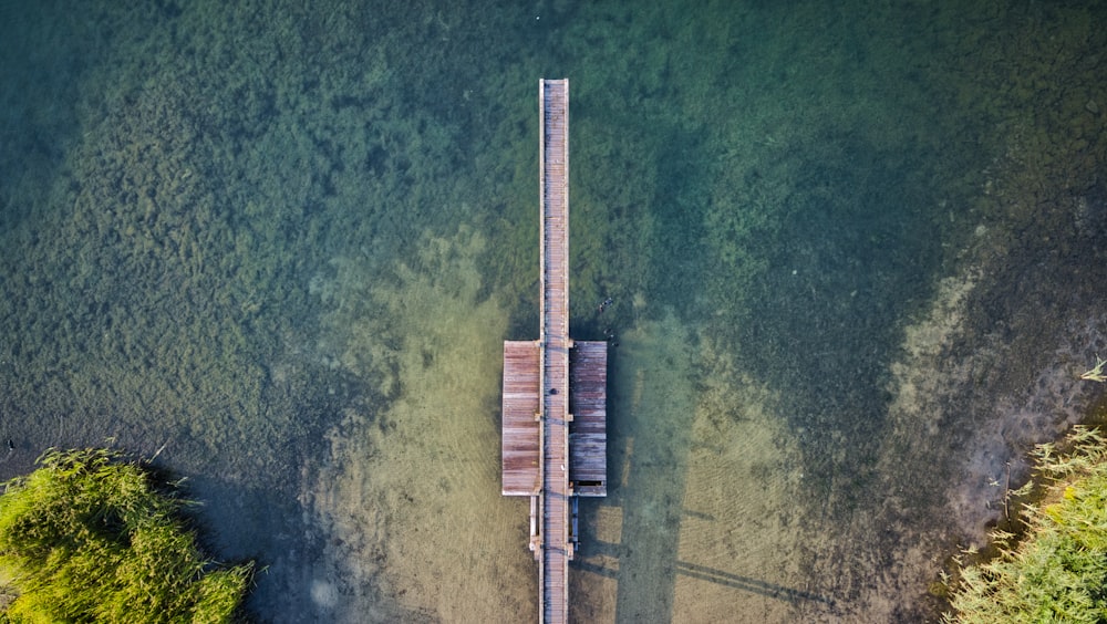 dock in body of water during daytime aerial-view photography