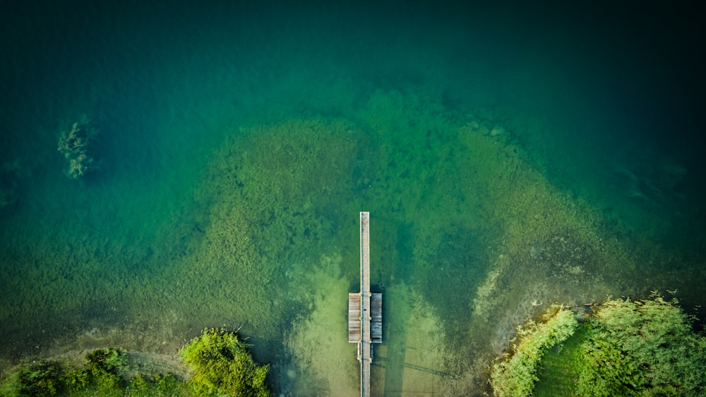 an aerial view of a dock in the water