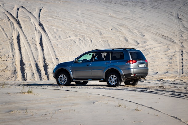 A clean, well-maintained SUV parked by a desert landscape outside Jaipur.