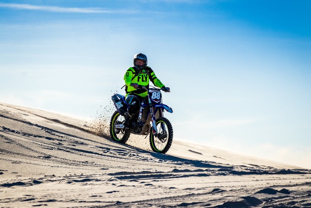 man riding motorcycle on desert