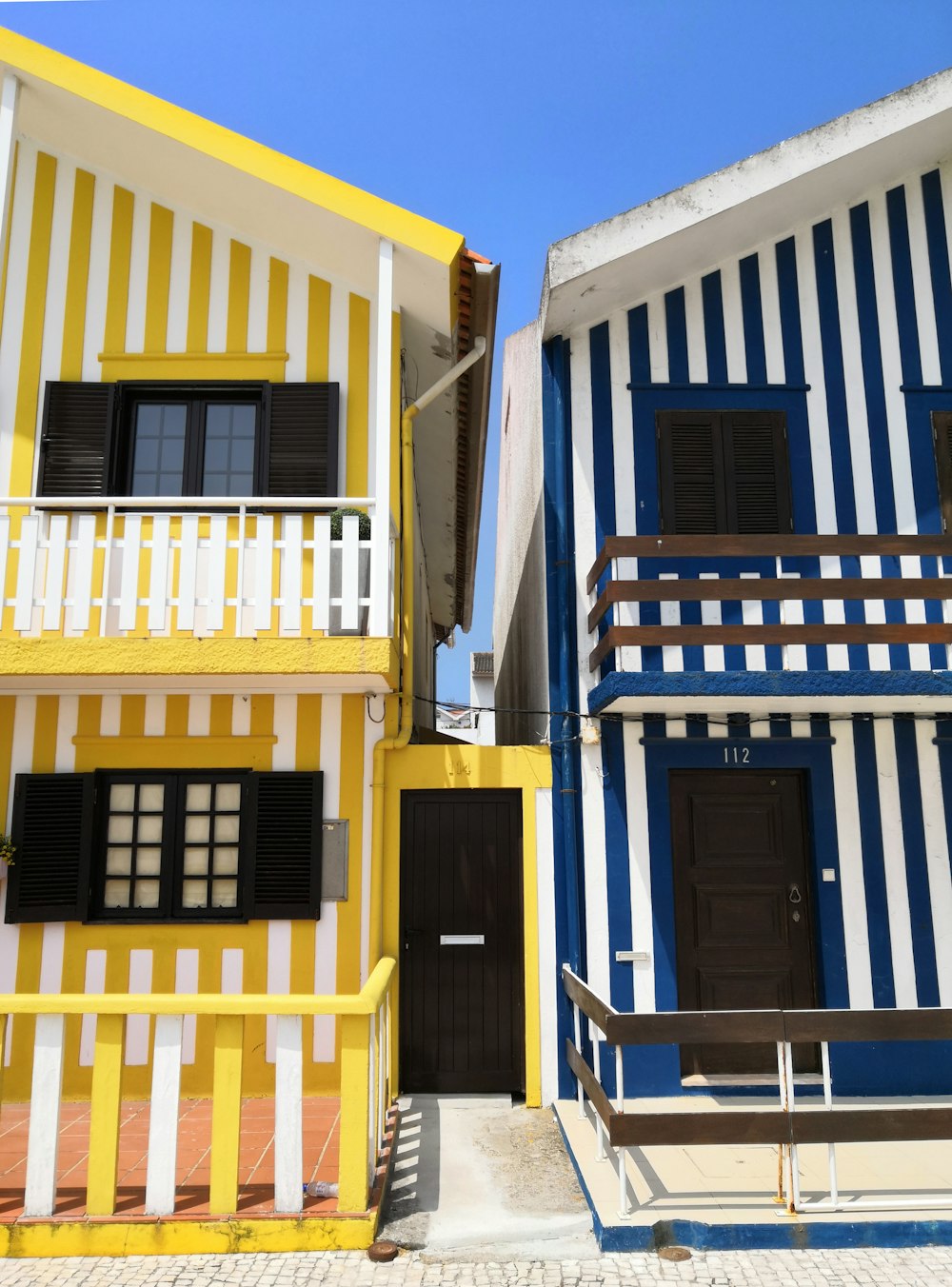 yellow and blue houses showing closed door