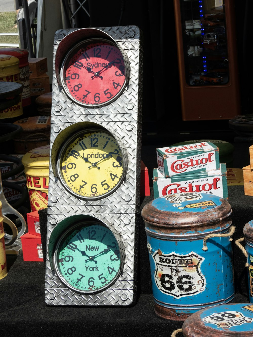 multicolored clock near blue can close-up photography