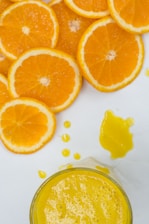 Close-up of fresh orange slices with juice droplets glistening in natural light.