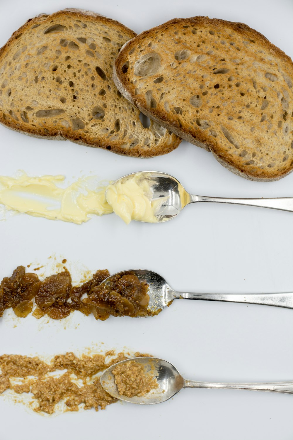 brown bread beside three spoons