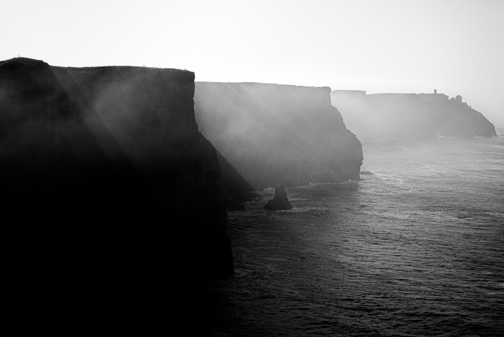 grayscale photography of cliff