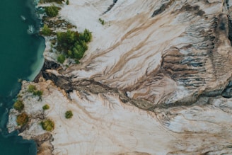 Aerial view of reclaimed arid land showing green patches.