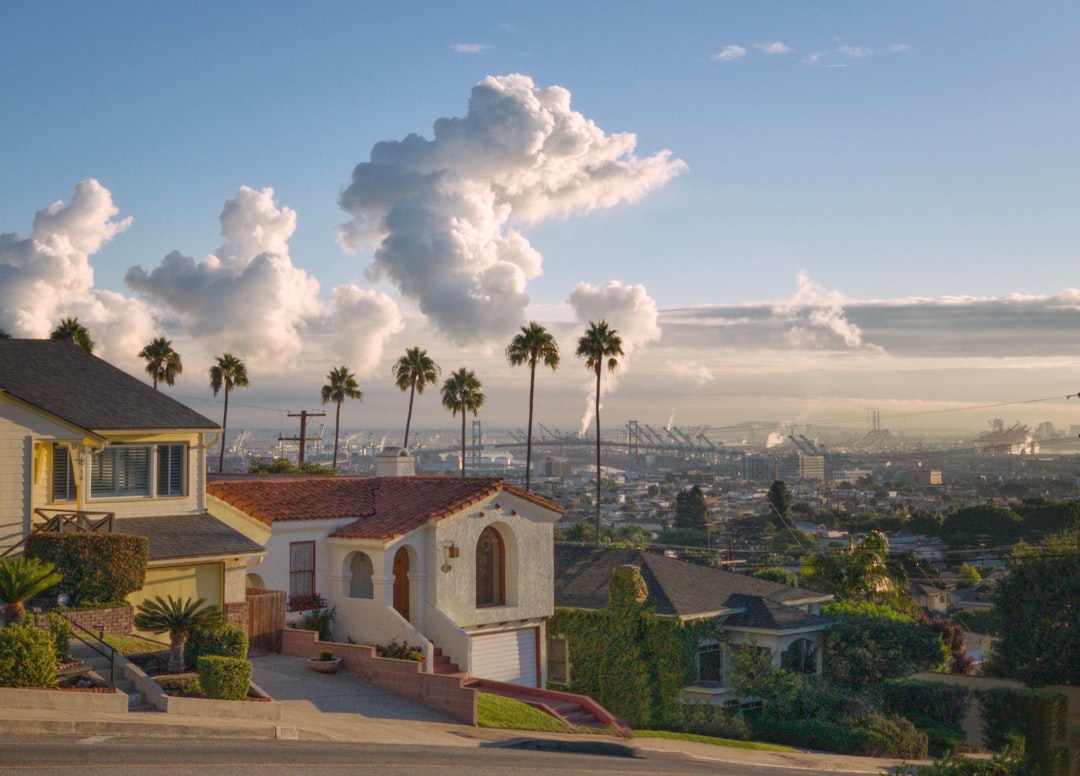 white and brown houses under blue sky, Harbor View from residential street