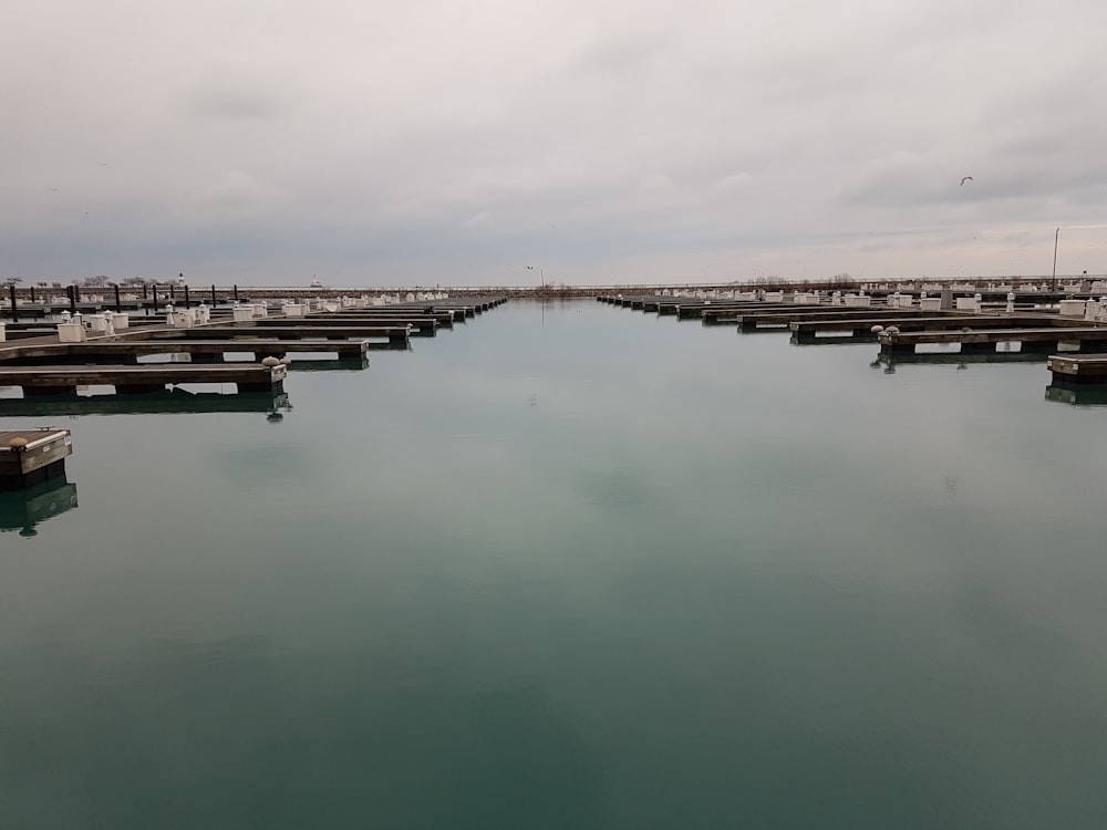 a large body of water surrounded by wooden piers