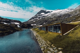 A scenic Swiss landscape with a building featuring advanced climate systems.