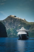 cruise ship near mountain during daytime
