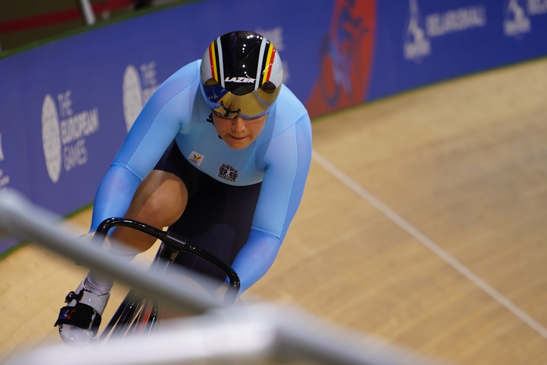 man riding bicycle on track, Athlete on the bike on the cycle track