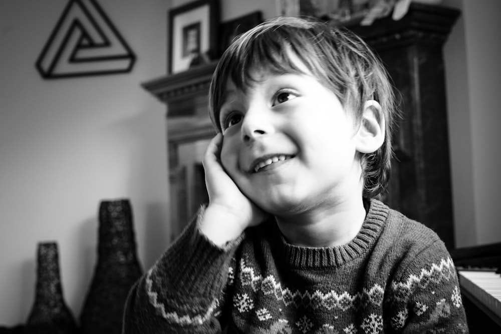 smiling boy in sweater