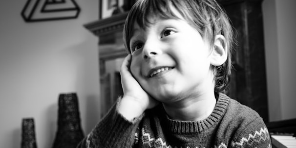 smiling boy in sweater