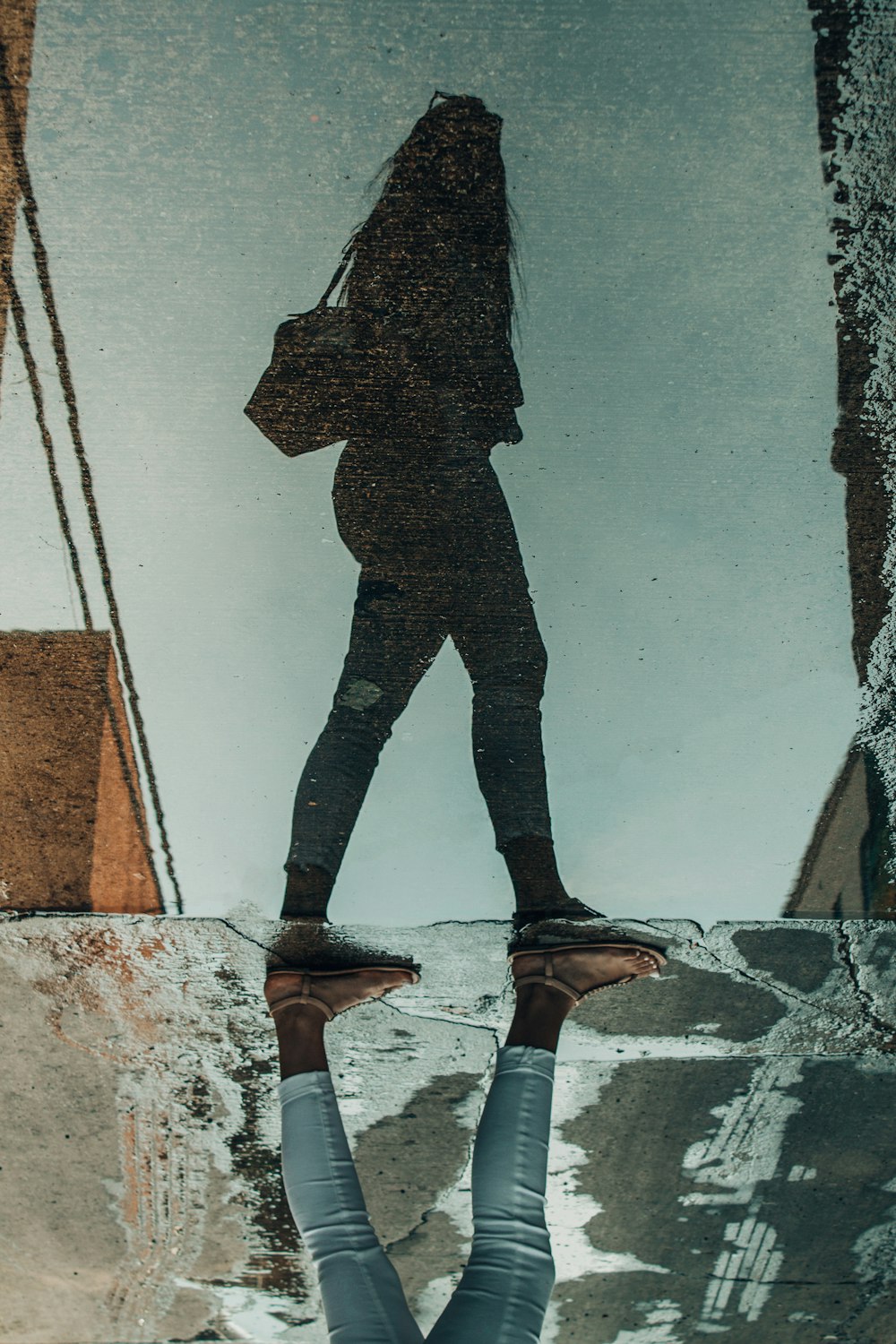 reflection of woman walking