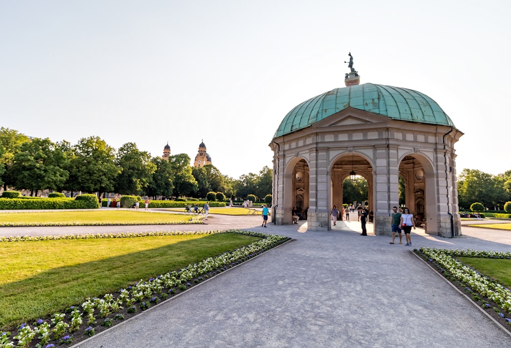 people walking beside dome building