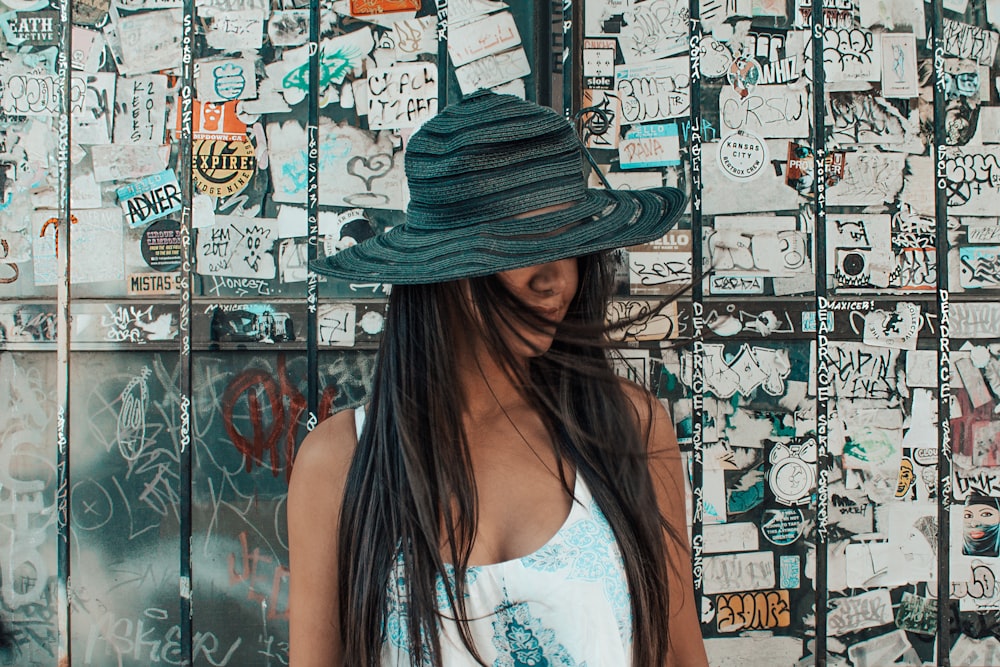 woman leaning on wall