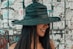 women's black sun hat close-up photography