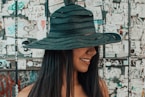 women's black sun hat close-up photography