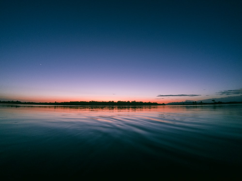 calm sea under clear blue sky