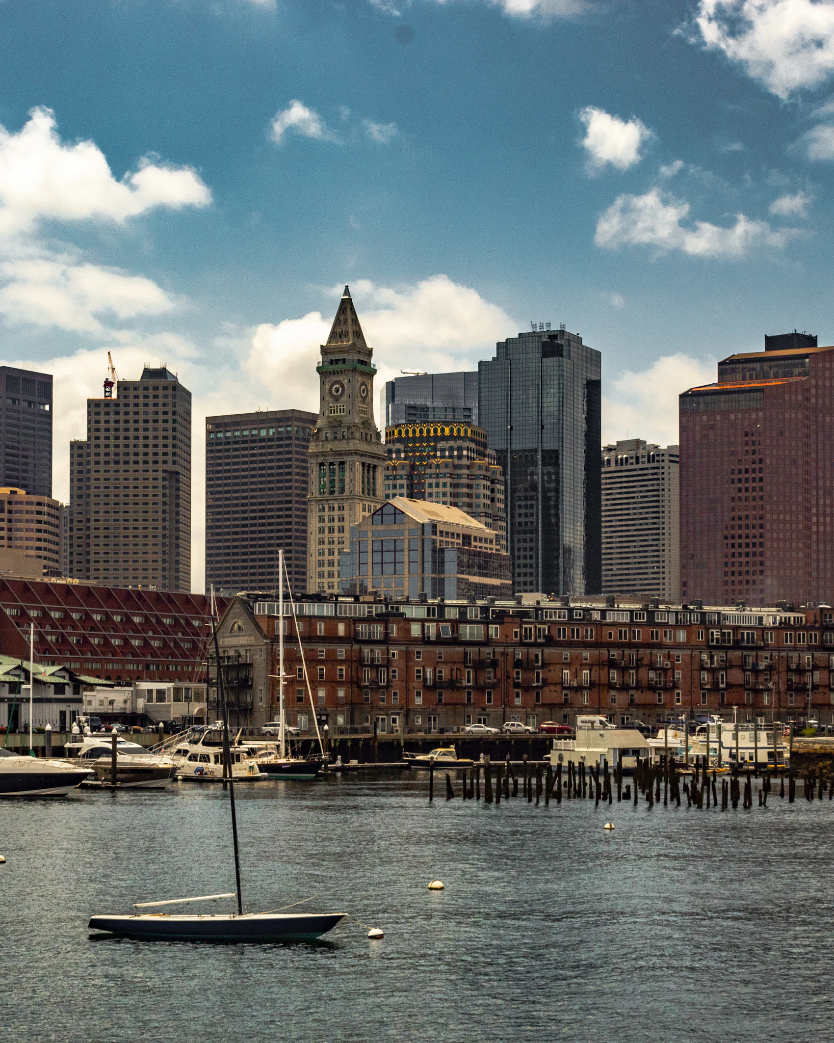 Boston skyline and harbour seen across calm blue water
