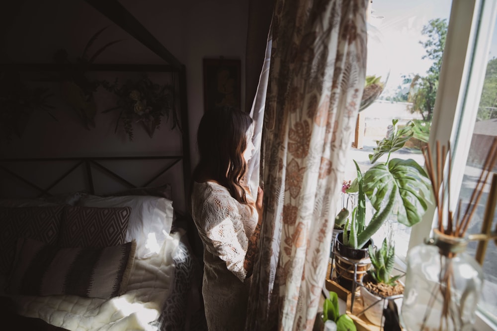 woman looking at window