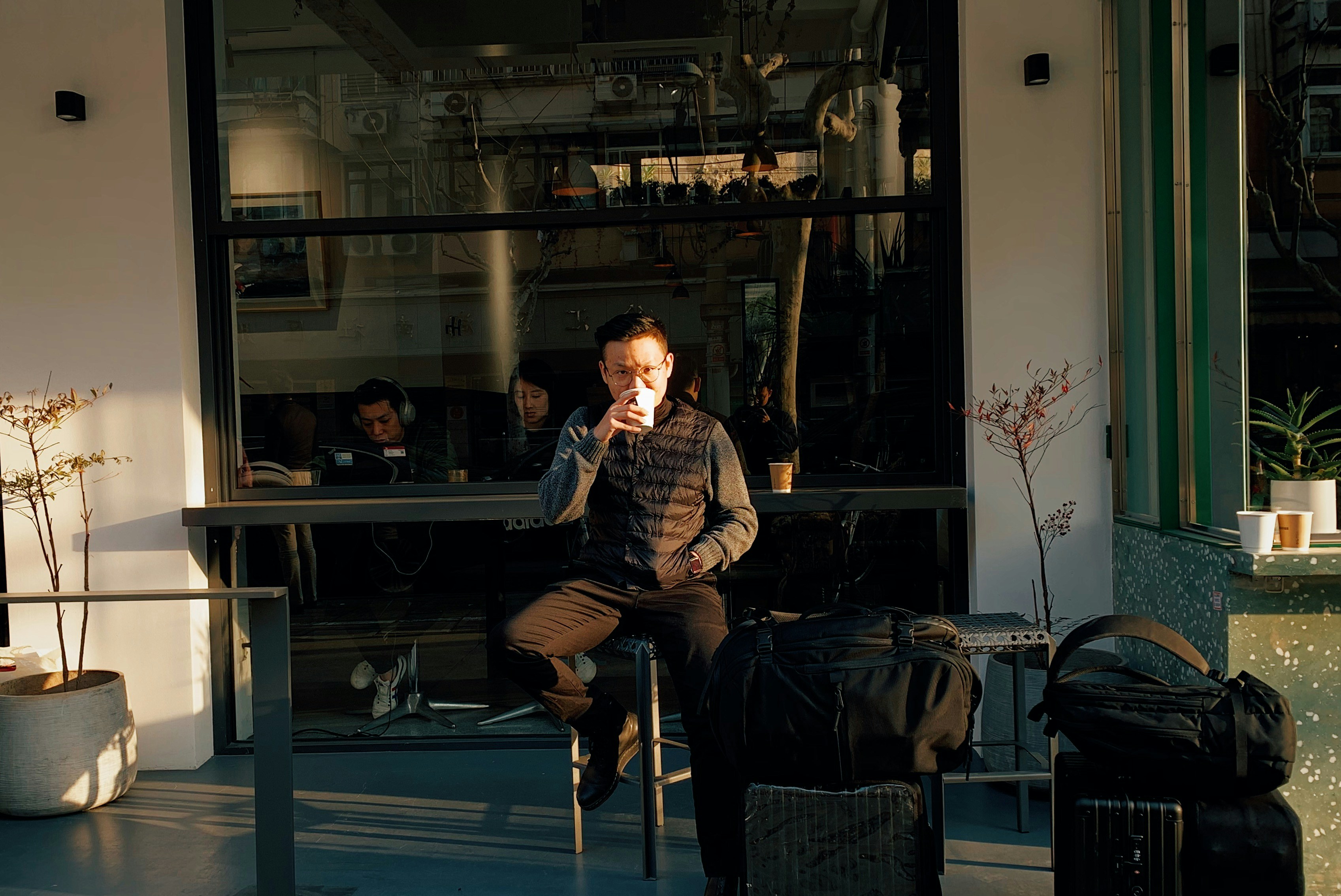 man sitting on stool during daytime