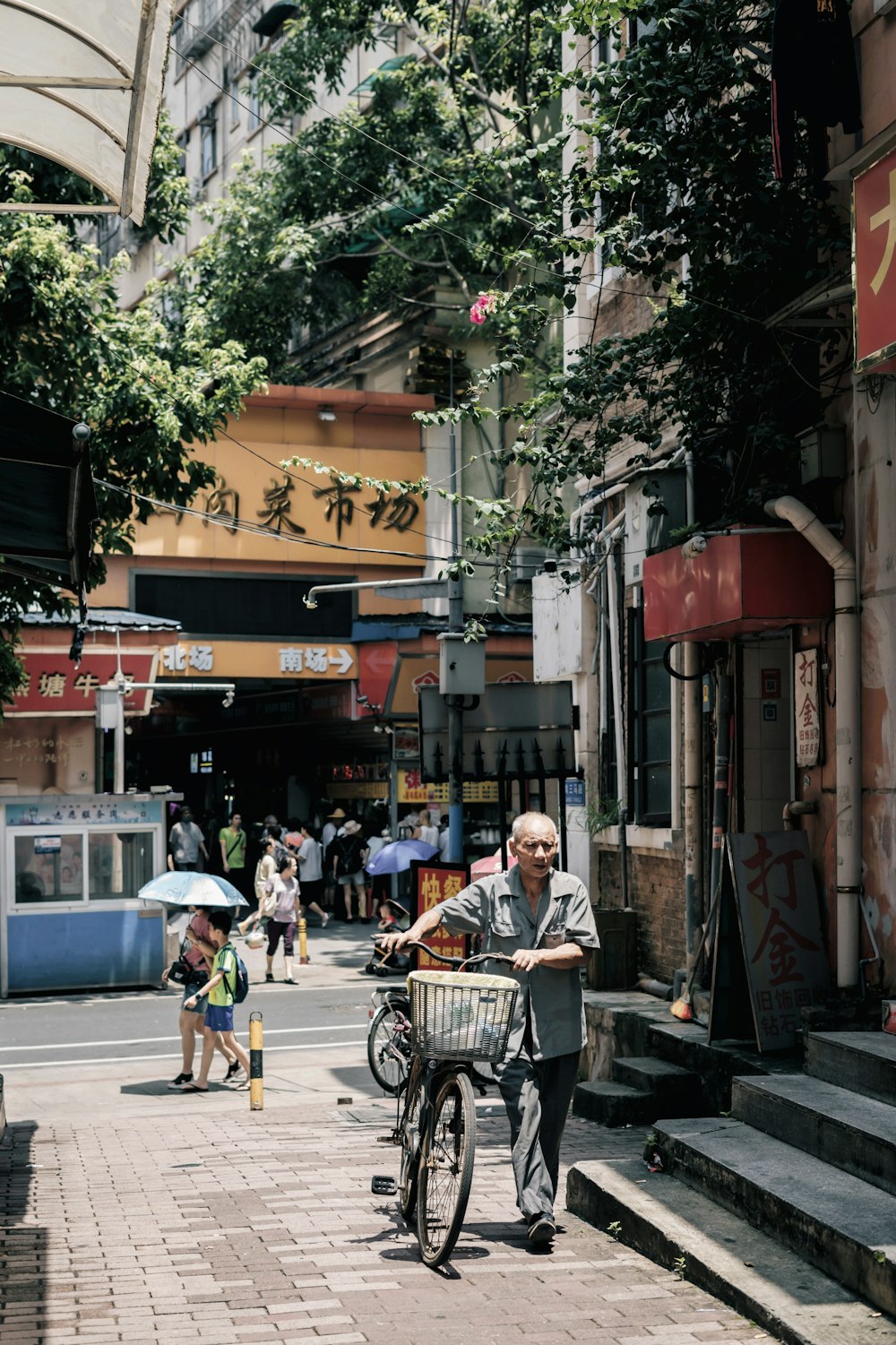 unknown person pushing bicycle outdoors