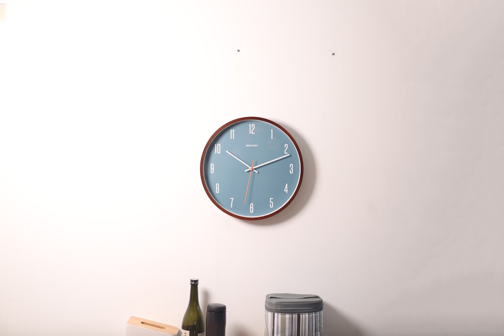 analog wall clock at 10:11 o'clock