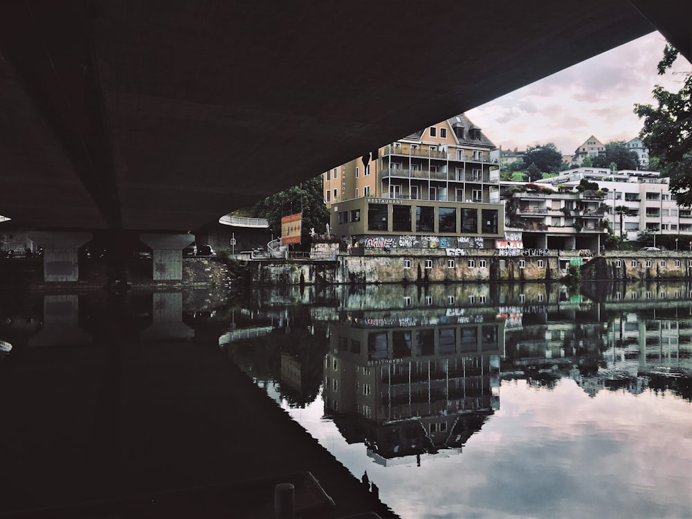 body of water with reflections of buildings