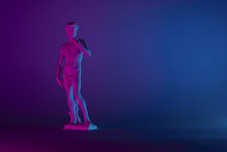 Deep blue background with silhouettes of Plato and Aristotle in Renaissance style.