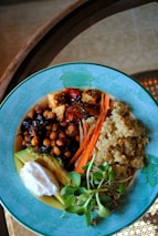 A colorful vegan meal bowl with fresh vegetables and grains, highlighting nutrition.