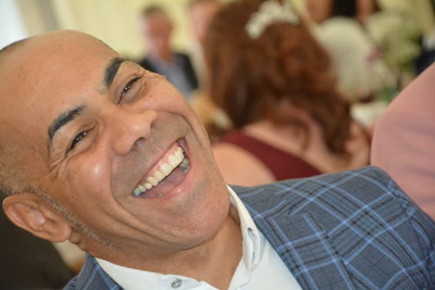 Close-up of the comedian sharing a candid laugh with fans after a live event.