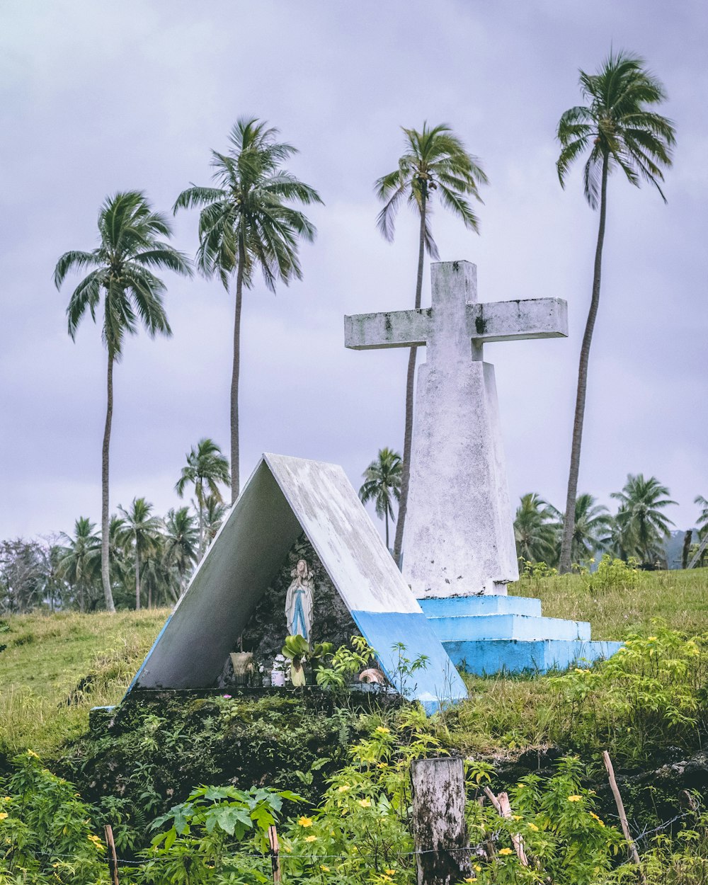 white and blue cross statue