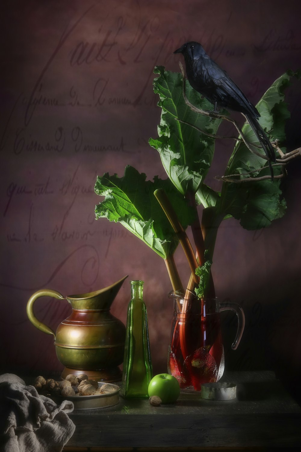 green leaf vegetables in glass pitcher