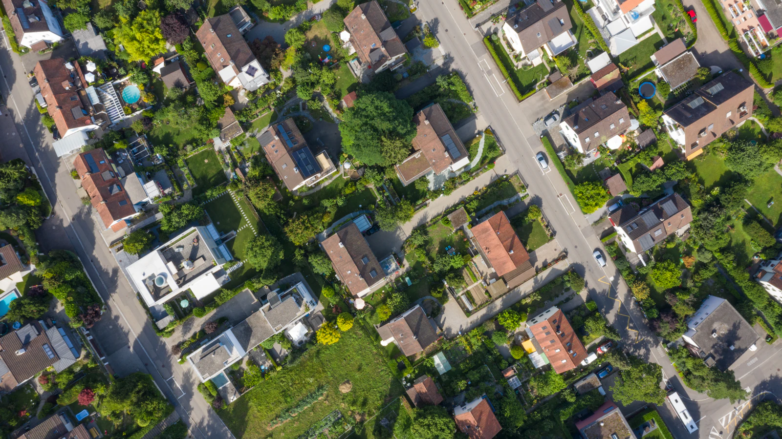 Aerial view of a coastal housing estate near the ocean.