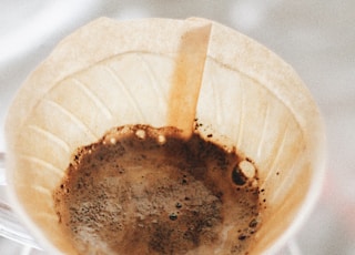 round white funnel with brown liquid