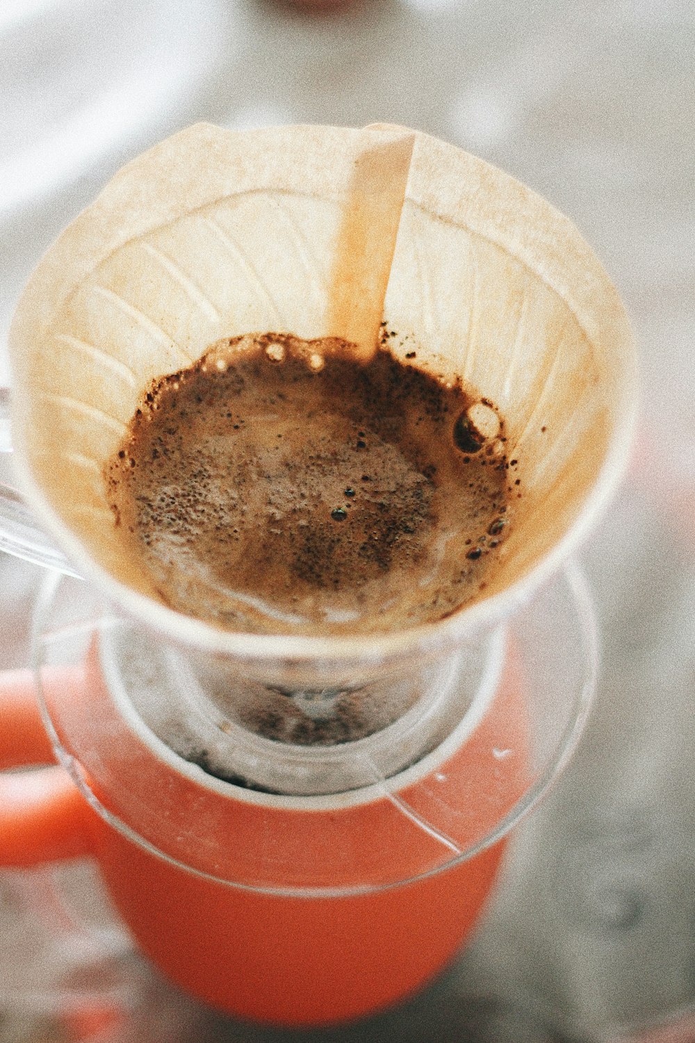 round white funnel with brown liquid