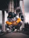 man wearing bucket hat holding DSLR camera