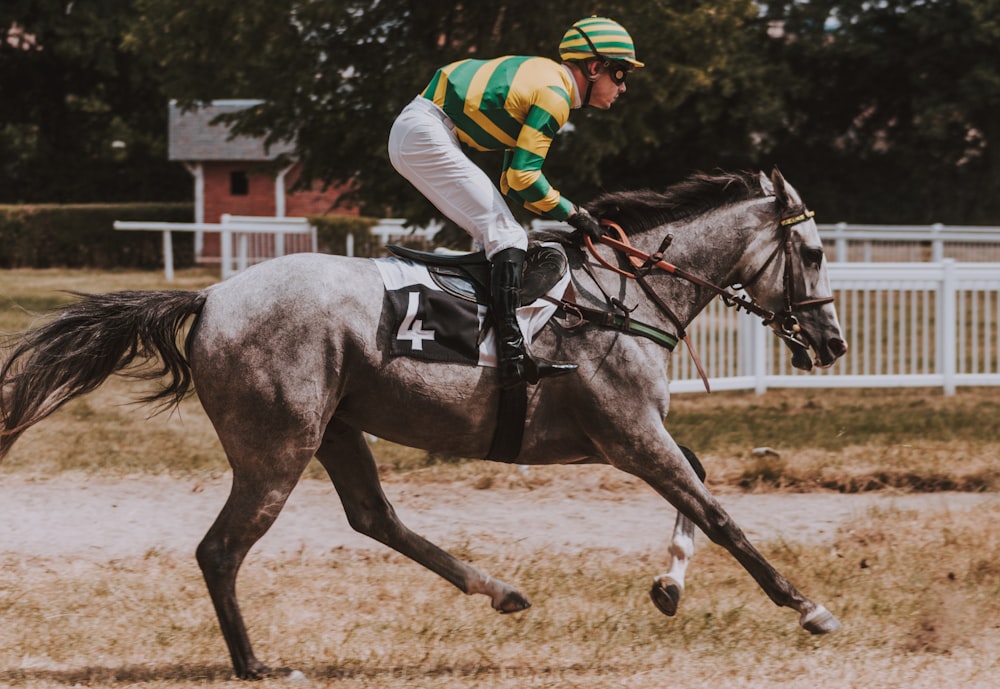 close-up photography of man riding horse