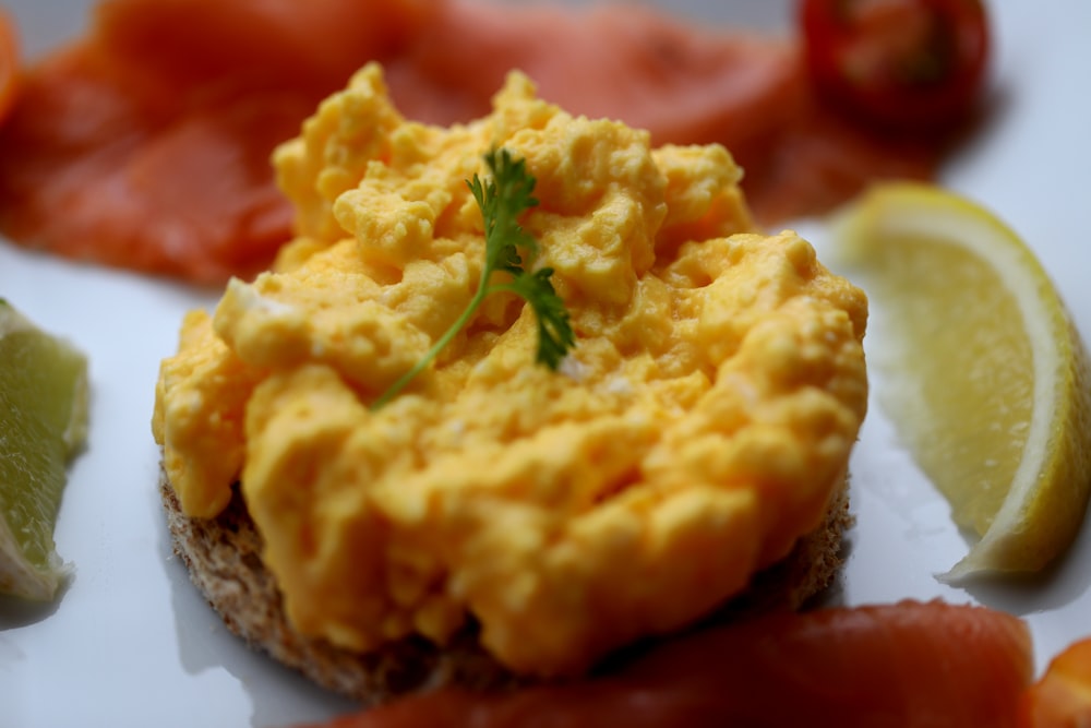 food with parsley on top near sliced lemon