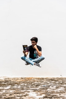 man siting while readign