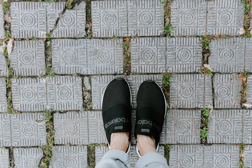 black Adidas slip ons